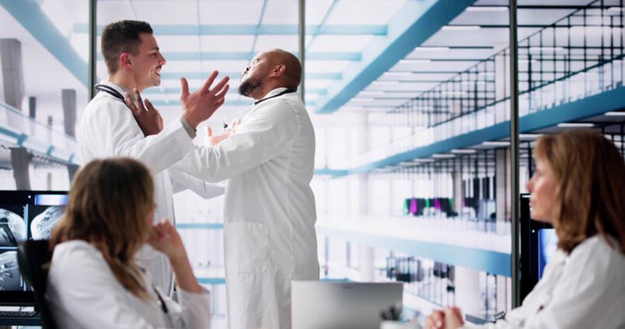 Man grabbing coworker in debate - Hostile Work Environment